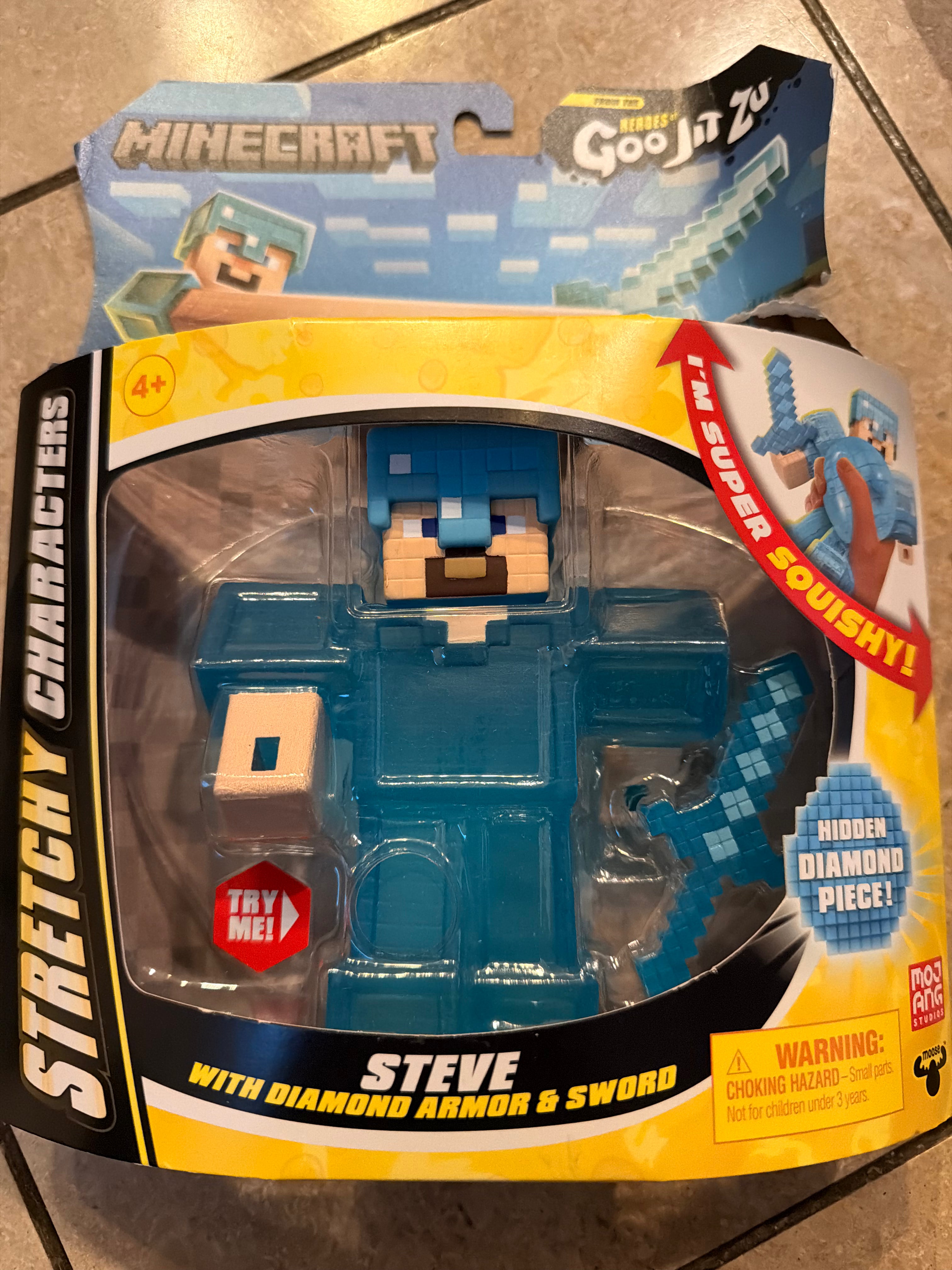 Heroes of Goo Jit Zu Minecraft Stretchy Characters, Steve with Diamond Armor & Sword, Super Squishy Goo Filling with Hidden Diamond Piece Inside, Stretch Him Up to 3 Times His Size - Sensory Toys
