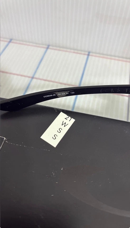 Oakley wrap polished black black iridium polarized sunglasses 009238-06